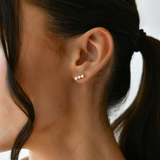 18K Gold Diamond Trio Stud Earrings with  model's ear