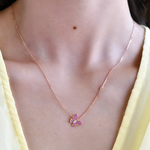 18K Rose Gold Pink Sapphire and Diamond Butterfly Necklace with model's neck