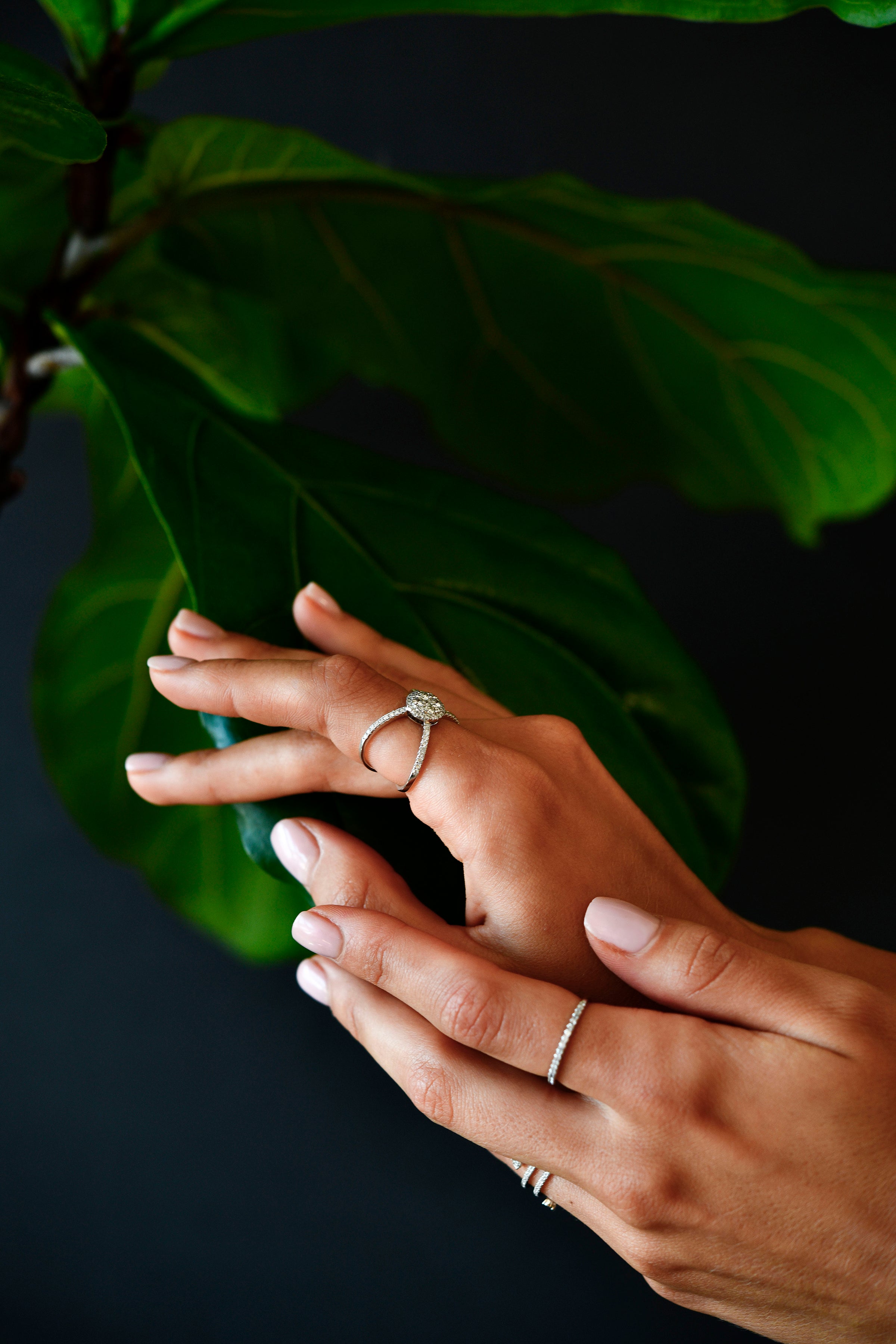 18K White Gold Criss - Cross Orbit Diamond Ring with model's hand