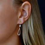 18K Yellow & White Gold Diamond Teardrop Earrings with model's ear