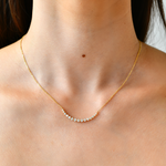 18K Gold Crescent Diamond Necklace with model's neck