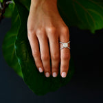 18K White Gold Criss - Cross Orbit Diamond Ring with model's hand