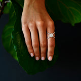 18K White Gold Criss - Cross Orbit Diamond Ring with model's hand