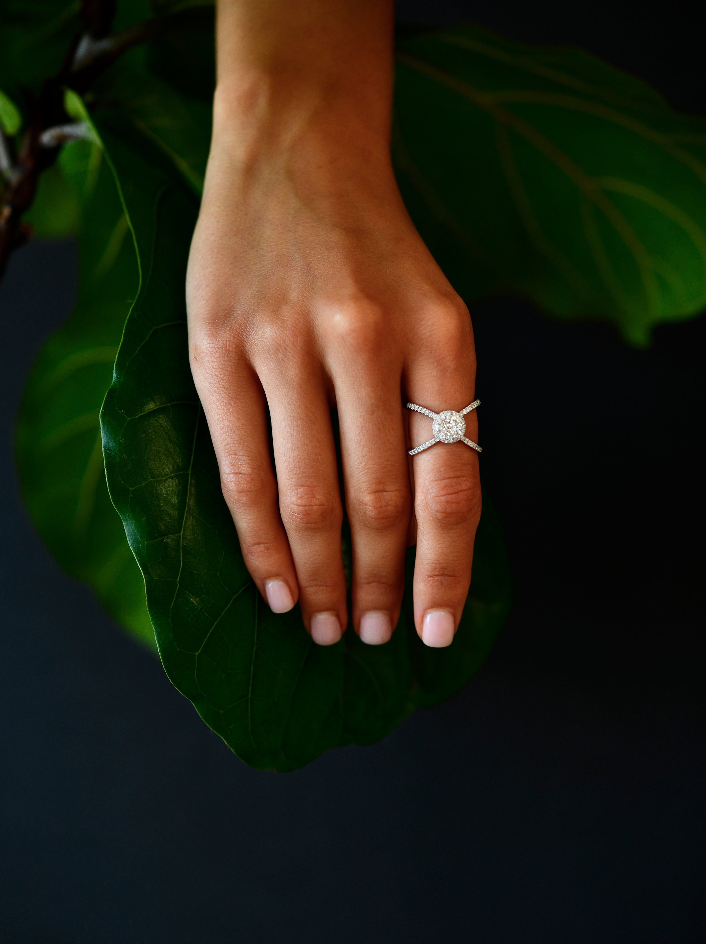 18K White Gold Criss - Cross Orbit Diamond Ring with model's hand