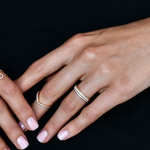 18K Gold Diamond Eternity Band with model's hand