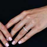 18K Gold Diamond Eternity Band with model's hand