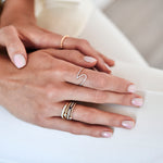 18K Gold Wavy Diamond Ring with model's hand