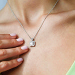 18K White Gold Multi Diamond Pendant with Halo with model's neck